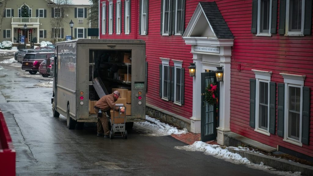 a person loading a van with flowers